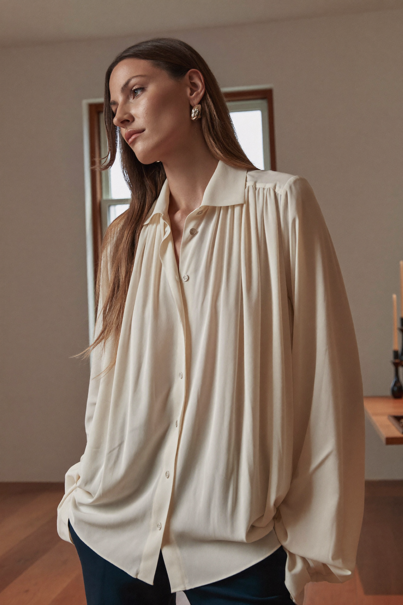 Elegant woman in ivory blouse